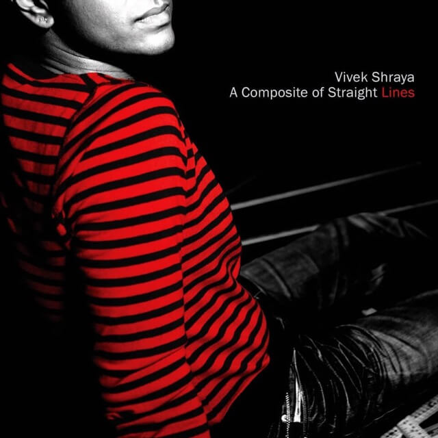 A seated person looking back over their shoulder. The only colour is the bright red stripes of their shirt; the rest of the photo is high-contrast black-and-white, and cropped just above their mouth. White text with red accent reads, “Vivek Shraya. A Composite of Straight Lines.”